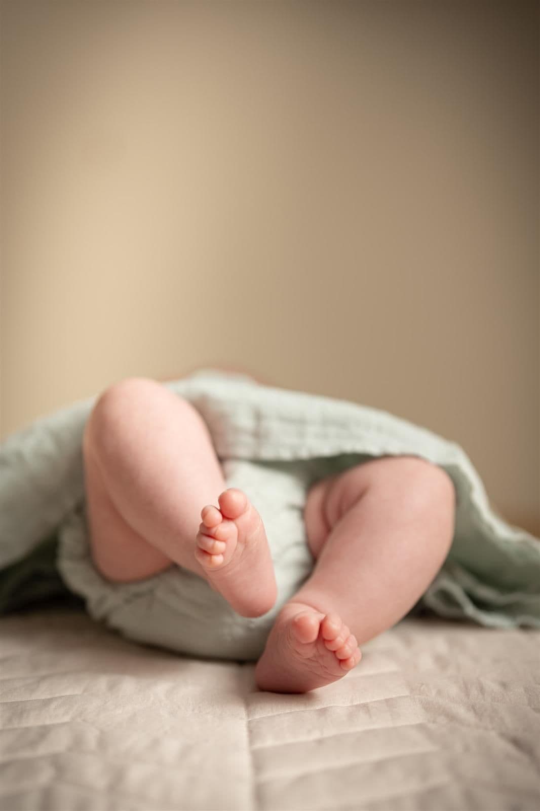 A pregnant woman having a massage while on her side.
