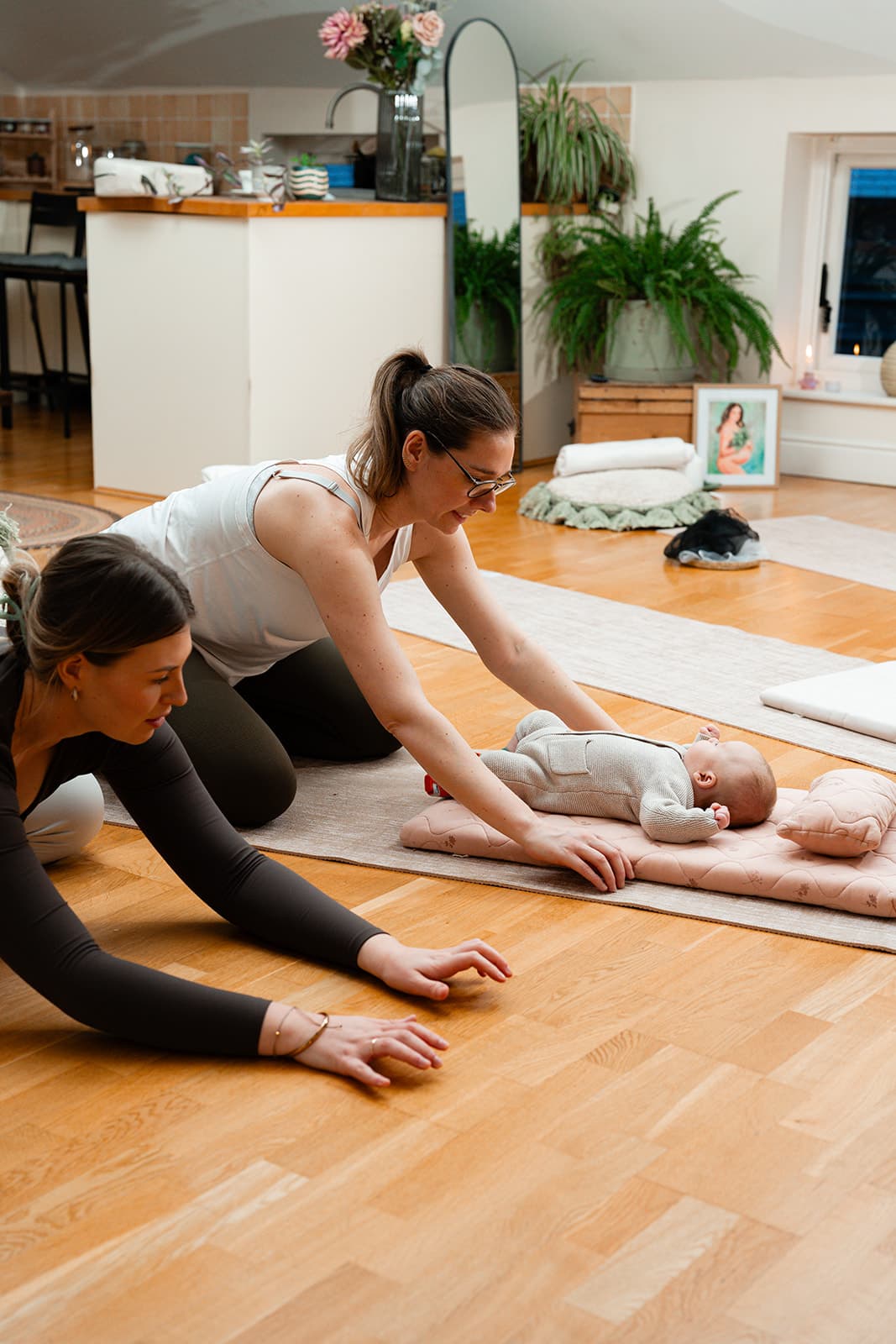 Rose sat on a yoga mat holding a chime.